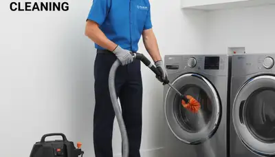 Technician performing professional dryer vent cleaning service in Milwaukee WI home